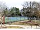 Well-maintained tennis courts with fencing and landscaping at 611 Vinings Estates Se Dr, Smyrna, GA 30126