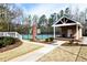 Tennis courts and adjacent pavilion with seating at 611 Vinings Estates Se Dr, Smyrna, GA 30126