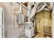 Utility room featuring a water heater and air conditioning unit at 611 Vinings Estates Se Dr, Smyrna, GA 30126