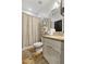 Cozy bathroom with shower-tub combination, neutral tones, and ample lighting at 9044 Riverbend Manor, Alpharetta, GA 30022