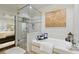 Luxurious bathroom features a glass shower, soaking tub, and stylish tile accents at 9044 Riverbend Manor, Alpharetta, GA 30022