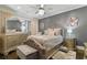 Cozy bedroom featuring neutral colors, chandelier, and large window at 9044 Riverbend Manor, Alpharetta, GA 30022