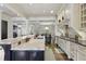 Elegant kitchen featuring a large island, stainless steel appliances, and an open layout at 9044 Riverbend Manor, Alpharetta, GA 30022