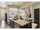 Open-concept kitchen with an island, granite countertops, and modern stainless steel appliances at 9044 Riverbend Manor, Alpharetta, GA 30022