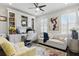 Bright home office with custom built-ins, a comfortable sofa, and natural light from the windows at 9044 Riverbend Manor, Alpharetta, GA 30022
