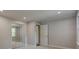 Bright bedroom has carpeted floors, a mirrored closet and access to another room at 1840 Linwood Ave, Atlanta, GA 30344