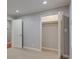 Bedroom features a closet with mirrored doors and access to another room at 1840 Linwood Ave, Atlanta, GA 30344