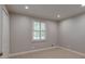 Bright bedroom with plush carpet, a window with natural light, and neutral paint at 1840 Linwood Ave, Atlanta, GA 30344
