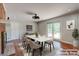 Elegant dining area with modern lighting, stylish furniture, and a view of the backyard at 1840 Linwood Ave, Atlanta, GA 30344