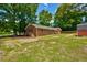 Beautiful brick house with a spacious backyard, storage shed, and well-manicured lawn at 1840 Linwood Ave, Atlanta, GA 30344