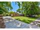 Lovely brick home with a long driveway and lush green lawn, perfect for outdoor activities at 1840 Linwood Ave, Atlanta, GA 30344