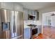 Kitchen with stainless steel refrigerator, gas range, and blue-gray cabinets at 1840 Linwood Ave, Atlanta, GA 30344