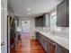 Well-lit kitchen with stainless steel appliances, gray cabinetry, and marble countertops at 1840 Linwood Ave, Atlanta, GA 30344