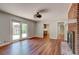 Living room featuring hardwood floors, a brick fireplace, and sliding glass doors to the exterior at 1840 Linwood Ave, Atlanta, GA 30344