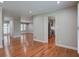 Open-concept living space with hardwood floors leading to the kitchen and front entrance at 1840 Linwood Ave, Atlanta, GA 30344