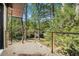 View of balcony showcasing backyard landscape and wooded scenery at 2568 Sugarplum Ne Ct, Atlanta, GA 30345