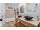 Bathroom featuring double vessel sinks, granite countertop, and tiled shower at 2568 Sugarplum Ne Ct, Atlanta, GA 30345