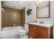 Bathroom featuring dark wood vanity and combined tub and shower at 2568 Sugarplum Ne Ct, Atlanta, GA 30345