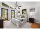 Bright bedroom with natural light, hardwood floors, ceiling fan and minimalist decor at 2568 Sugarplum Ne Ct, Atlanta, GA 30345