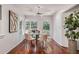 Bright breakfast nook with a glass table, four chairs, ceiling fan and natural light at 2568 Sugarplum Ne Ct, Atlanta, GA 30345