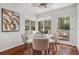 Inviting breakfast nook features a cozy bench, a ceiling fan, and bright views of the backyard at 2568 Sugarplum Ne Ct, Atlanta, GA 30345
