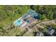Aerial shot of community pool and tennis courts surrounded by lush trees at 2568 Sugarplum Ne Ct, Atlanta, GA 30345