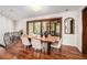Bright dining room with hardwood floors, modern lighting, and sliding glass doors to outside at 2568 Sugarplum Ne Ct, Atlanta, GA 30345
