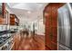 Open kitchen with wood cabinets, stainless steel appliances, and eat-in dining area at 2568 Sugarplum Ne Ct, Atlanta, GA 30345