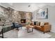 Comfortable living room features stone fireplace, cozy seating, and stylish decor at 2568 Sugarplum Ne Ct, Atlanta, GA 30345
