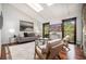 Bright living room with hardwood floors and comfortable seating by large windows at 2568 Sugarplum Ne Ct, Atlanta, GA 30345