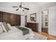 Relaxing main bedroom with wood floors, ceiling fan, closet space, and dresser with mirror at 2568 Sugarplum Ne Ct, Atlanta, GA 30345