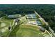Aerial view of tennis courts, golf greens, clubhouse, and surrounding greenery at 52 25Th Nw St, Atlanta, GA 30309