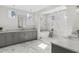 Luxurious bathroom featuring marble accents, custom cabinetry, soaking tub, and dual vanities for an elegant experience at 52 25Th Nw St, Atlanta, GA 30309