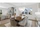 Elegant dining room with modern chandelier, large windows, and views into the living room at 52 25Th Nw St, Atlanta, GA 30309