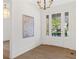 Elegant foyer with hardwood floors, chandelier, and a grand front door with sidelights at 52 25Th Nw St, Atlanta, GA 30309