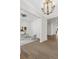 Bright foyer showcasing hardwood floors, elegant lighting, and an adjacent home office space at 52 25Th Nw St, Atlanta, GA 30309