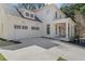 Expansive two-car garage showcasing carriage doors and exterior lighting, adding to the home's curb appeal at 52 25Th Nw St, Atlanta, GA 30309