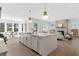 Open concept kitchen with eat-in island, with views of the living room and dining area at 52 25Th Nw St, Atlanta, GA 30309
