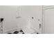 Laundry room with tile flooring, cabinets, and utility connections at 52 25Th Nw St, Atlanta, GA 30309