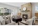 Living room featuring stone fireplace, open view to the dining room, and modern furnishings at 52 25Th Nw St, Atlanta, GA 30309