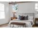 Inviting main bedroom boasts natural light, wood accents, and a plush bed for ultimate relaxation at 52 25Th Nw St, Atlanta, GA 30309