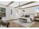 Bright main bedroom with wood beams, large windows, and stylish decor for a comfortable, airy feel at 52 25Th Nw St, Atlanta, GA 30309