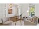 Bright home office featuring a glass top desk, stylish decor, chandelier, and natural light at 52 25Th Nw St, Atlanta, GA 30309