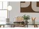 Bright home office featuring a glass top desk, stylish decor and modern lamp at 52 25Th Nw St, Atlanta, GA 30309