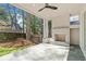 Covered patio featuring a stone floor, a white brick fireplace, and views of the backyard at 52 25Th Nw St, Atlanta, GA 30309