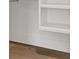 Close-up of hardwood flooring, white trim, and a built-in bookshelf at 52 25Th Nw St, Atlanta, GA 30309