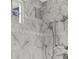 Modern marble-tiled shower with dual shower heads and a window for natural light at 52 25Th Nw St, Atlanta, GA 30309