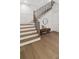 Elegant staircase features wood steps, black metal railing, and stylish decor for a sophisticated look at 52 25Th Nw St, Atlanta, GA 30309