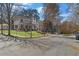 Neighborhood street view showcasing a beautifully landscaped corner lot with sidewalks and mature trees at 52 25Th Nw St, Atlanta, GA 30309