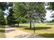 Picturesque walking path with signs along the trail, set among lush greenery and a golf course at 52 25Th Nw St, Atlanta, GA 30309